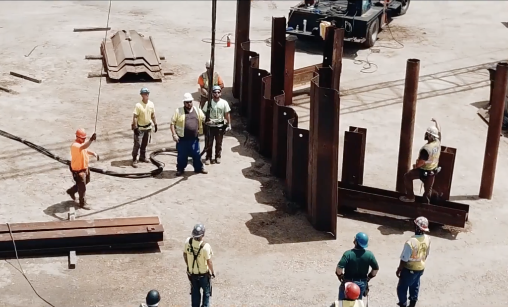 UBC Pile Drivers moving steel beams